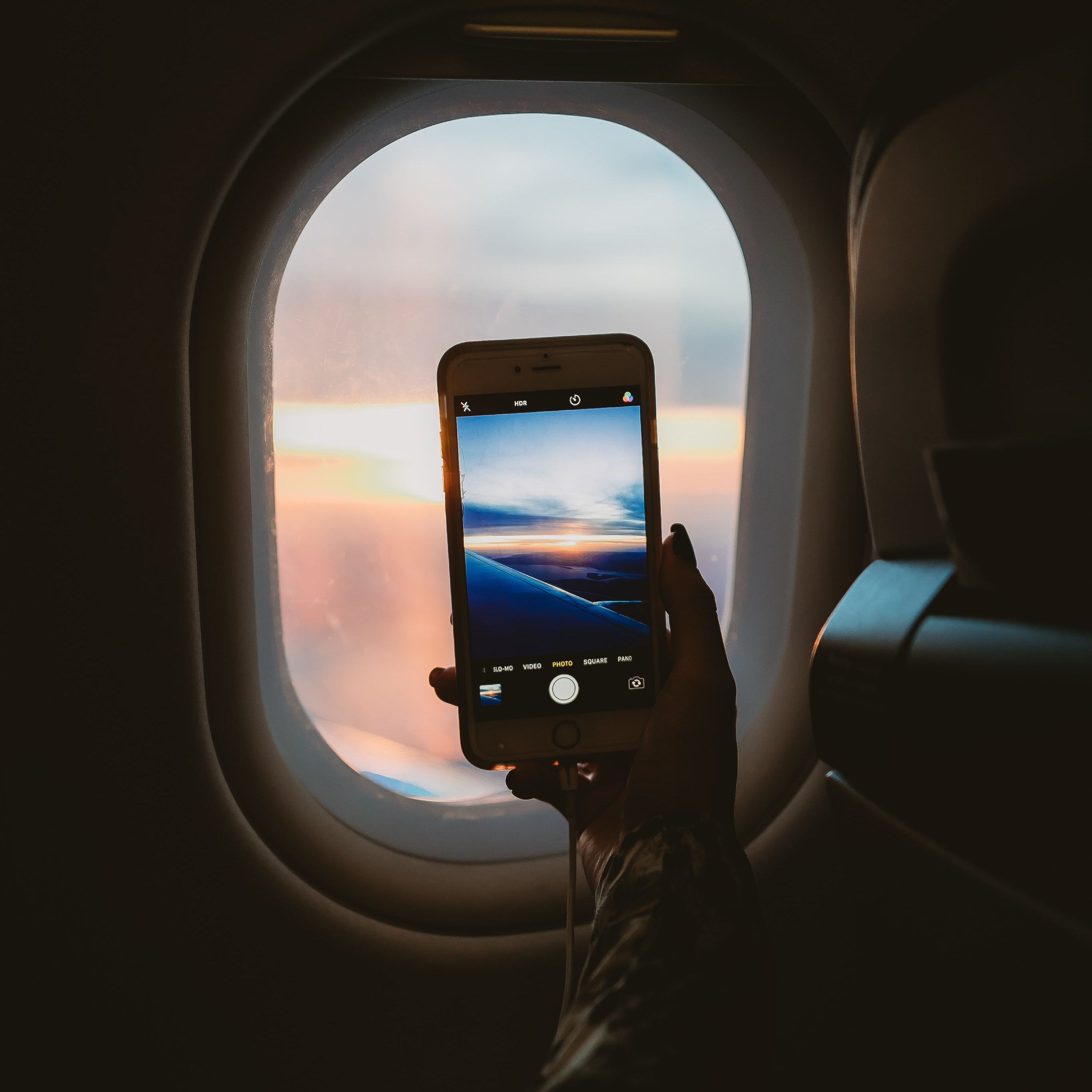 taking-a-picture-through-plane-window